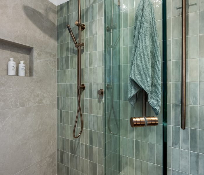 Main bathroom renovation in Dingley Village with freestanding bath, frameless shower, timber vanity and stone-look tiles.